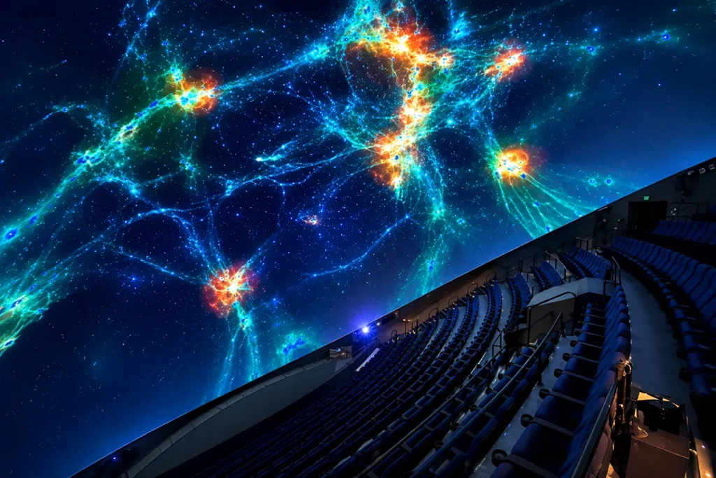 Taylor Planetarium dome interior at Museum of the Rockies with reclining theater seats