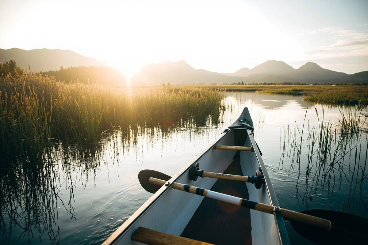 Canoe paddling through marshland on the Clearwater Canoe Trail near Seeley Lake