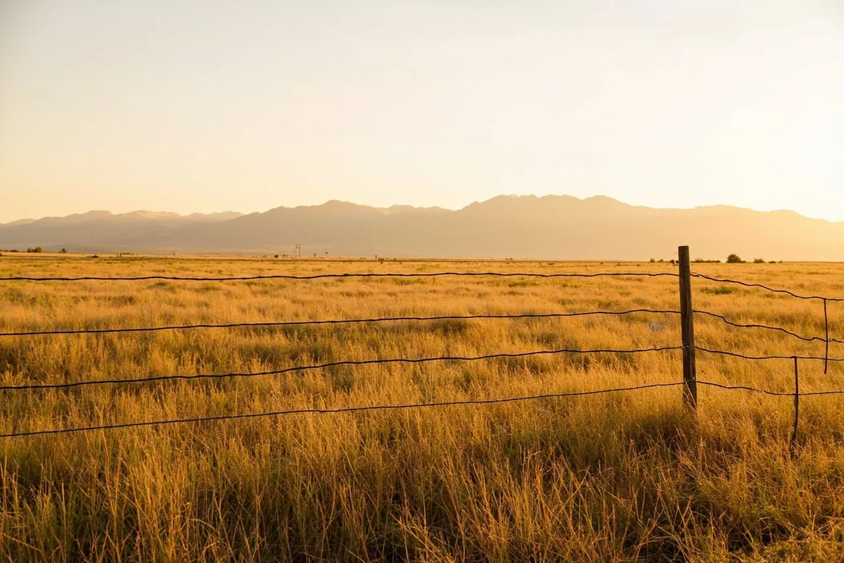 Madison Valley ranch land near Ennis Lake with mountains in the background