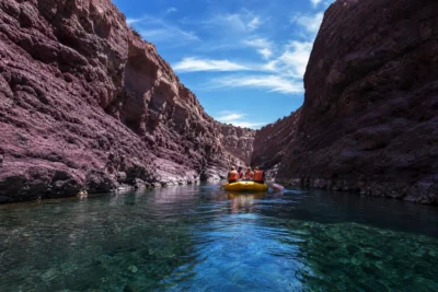raft floating through the volcanic rock canyon of 1 - Dearborn River Montana: The Complete Guide