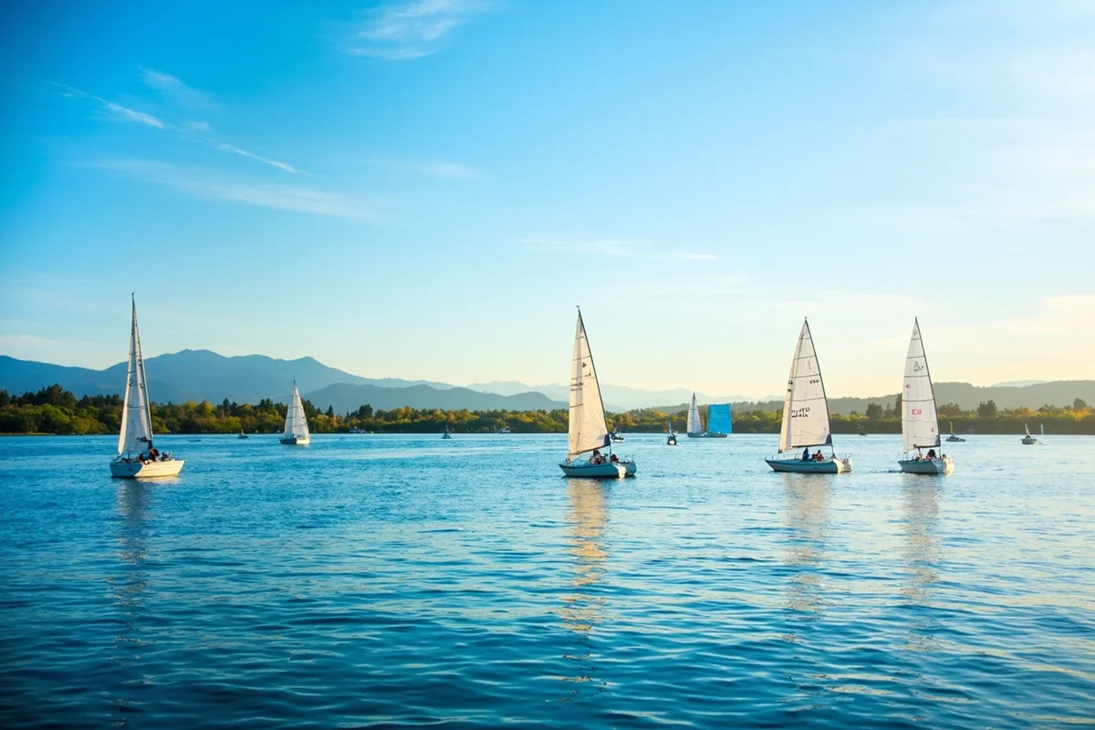 Sailboats on Flathead Lake with the Mission Mountains in the background