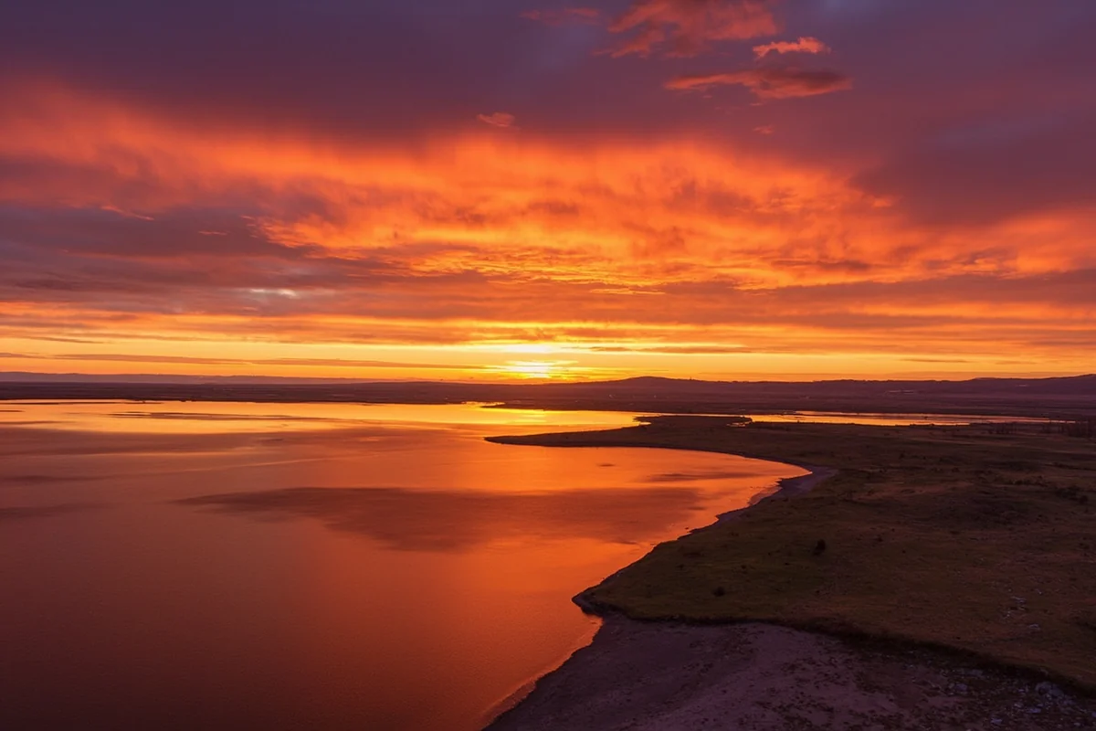 Sunset light on Lake Elwell with the earthen dike visible in the distance