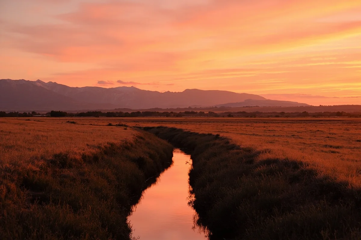 Sunset over the Ruby Valley near Sheridan, Montana with mountains silhouetted in the background